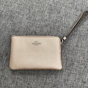 Gold coach wristlet